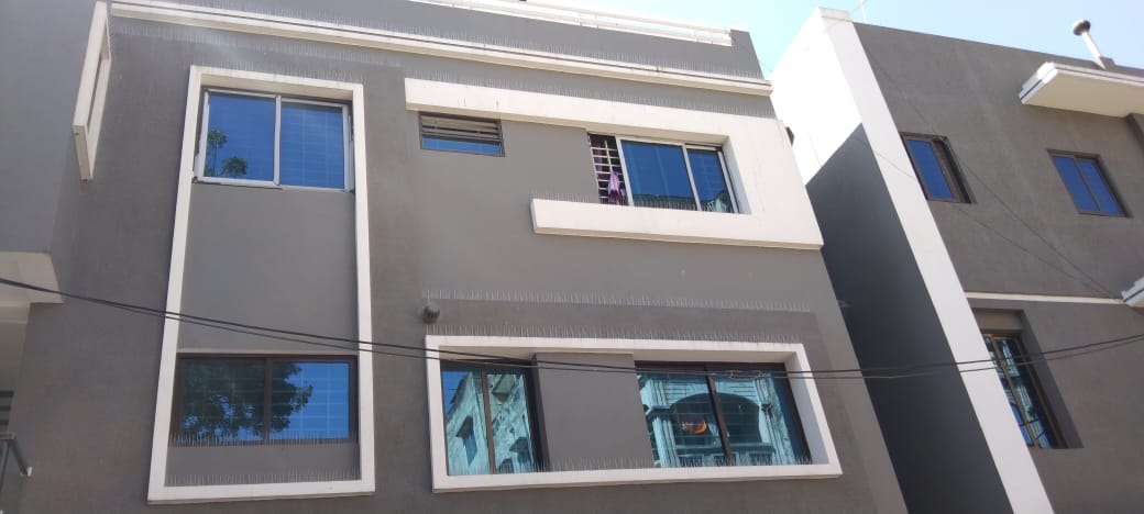 Bird spikes on residential building windows and ledges